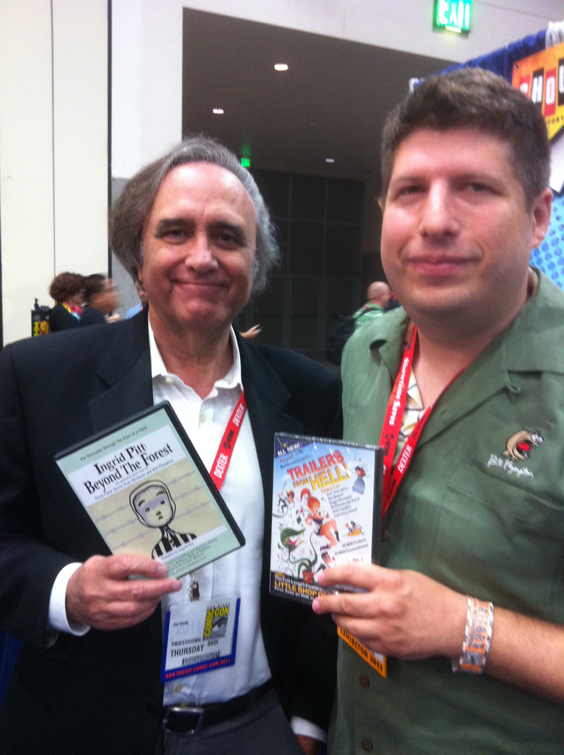 Joe Dante and Kevin Sean Michaels holding DVDs